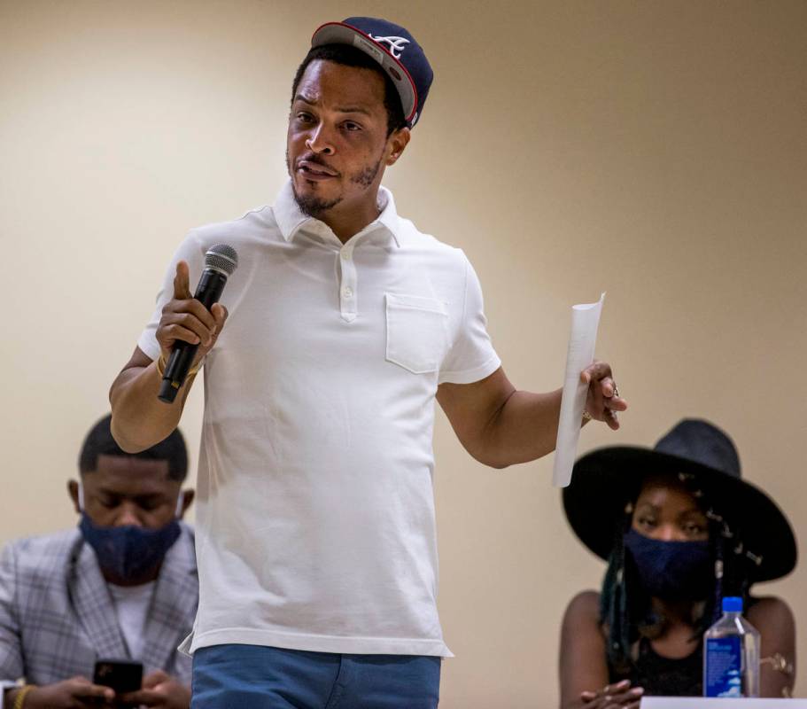 Rapper and entrepreneur Tip T.I. Harris, center, speaks while moderating a Solutions, Strategie ...
