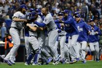 The Los Angeles Dodgers celebrate after Game 7 of the National League Championship Series baseb ...