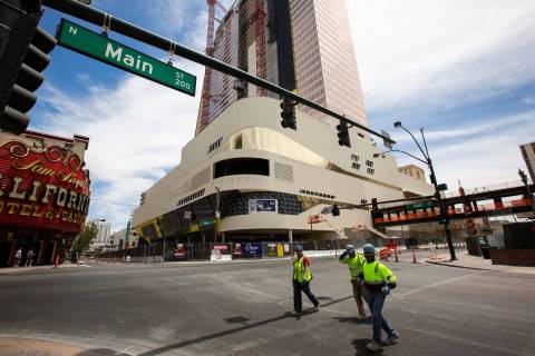 Construction workers walk down Main Street away from the Circa construction site in Las Vegas o ...