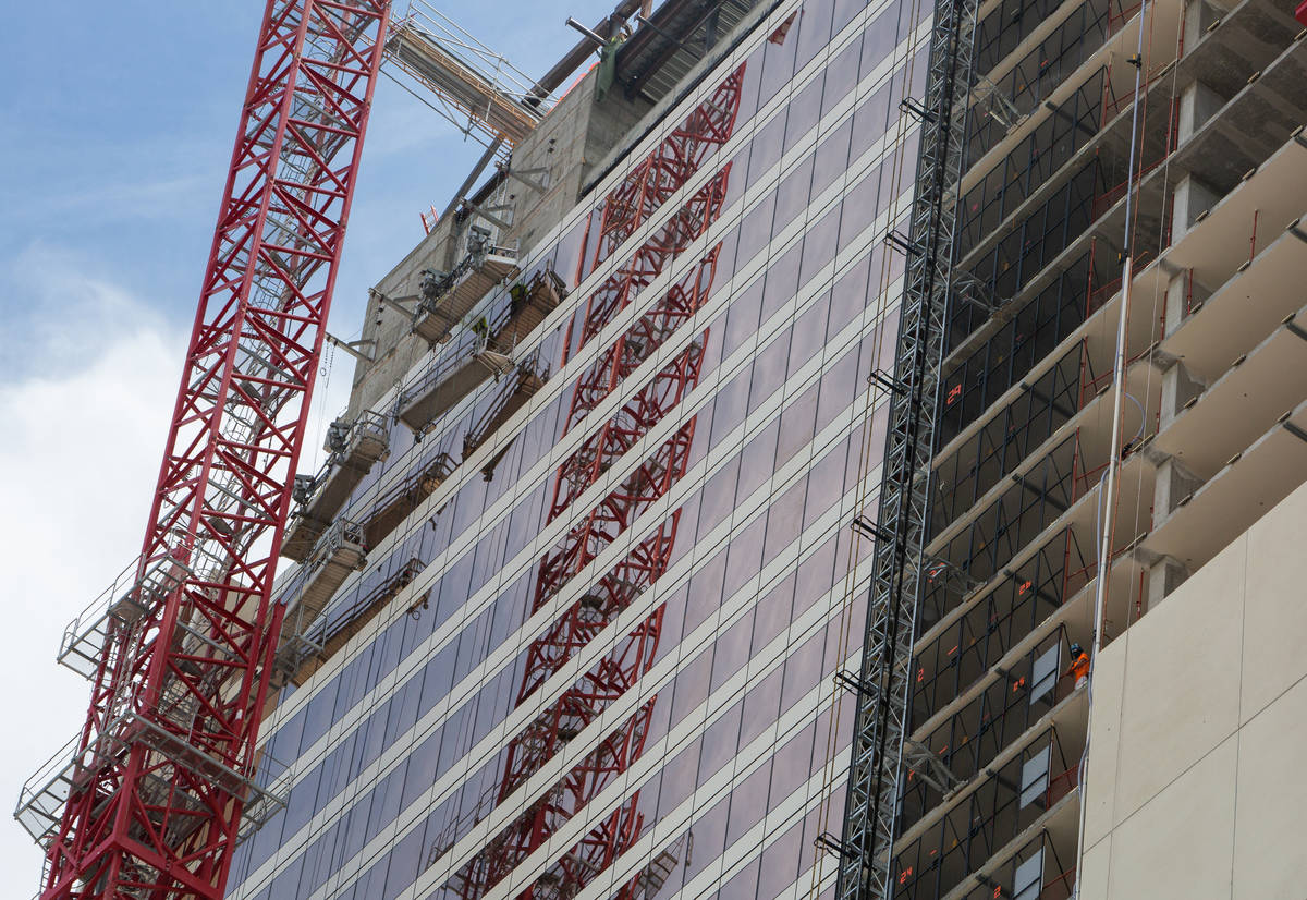 A construction worker looks out from the Circa construction site in Las Vegas on Wednesday, Jun ...