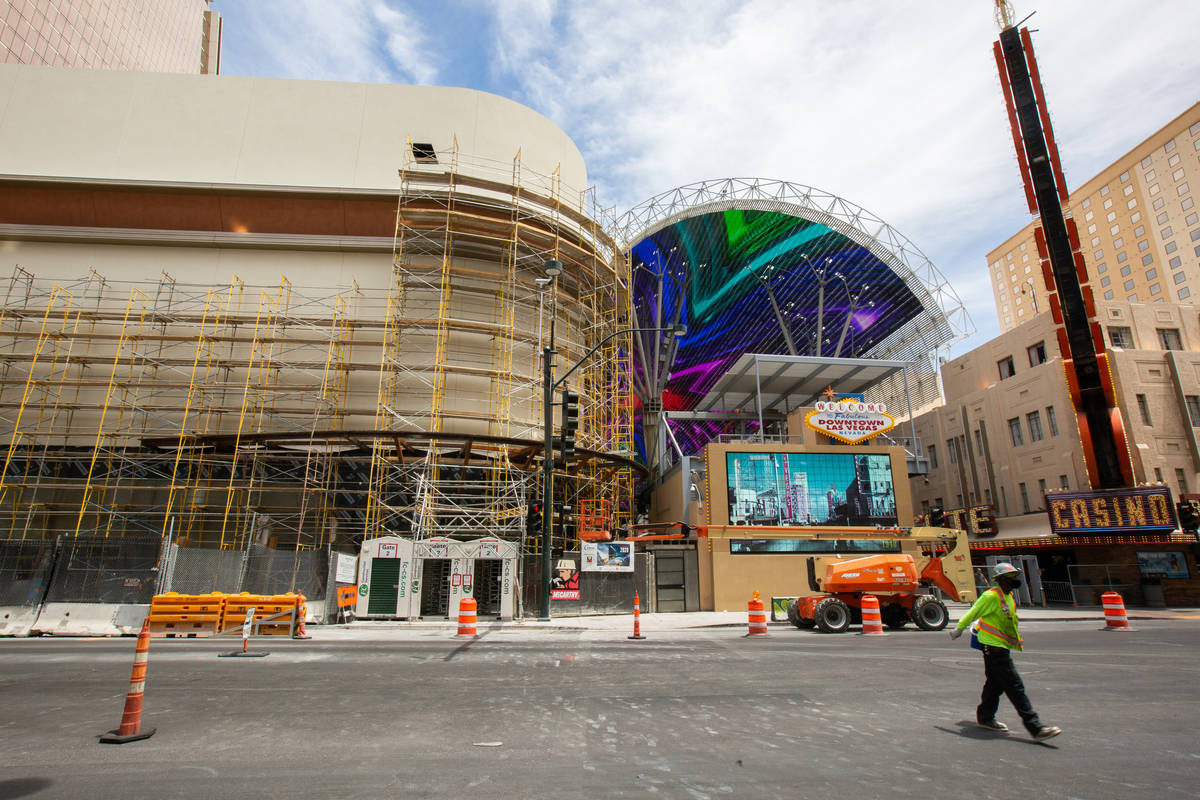 A construction worker walks down Main Street away from the Circa construction site in front of ...