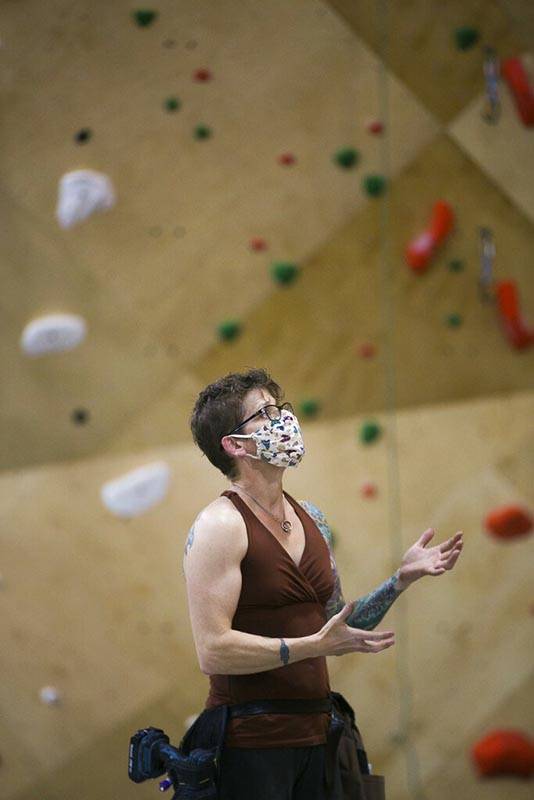 Molly Beard wears a mask as she shares her experience becoming a world-class route setter Tuesd ...