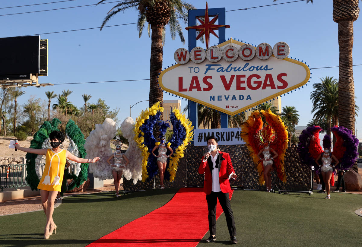Edie from Zumanity by Cirque du Soleil and host Bryan Chan walk the red carpet at the Welcome t ...