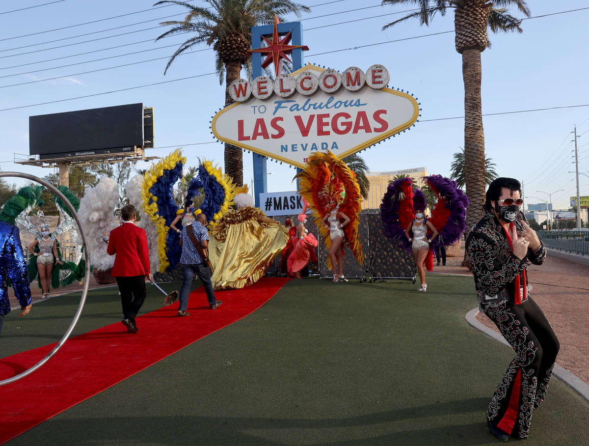 Elvis Impersonator Brendan Paul poses at the Welcome to Fabulous Las Vegas sign on the south St ...