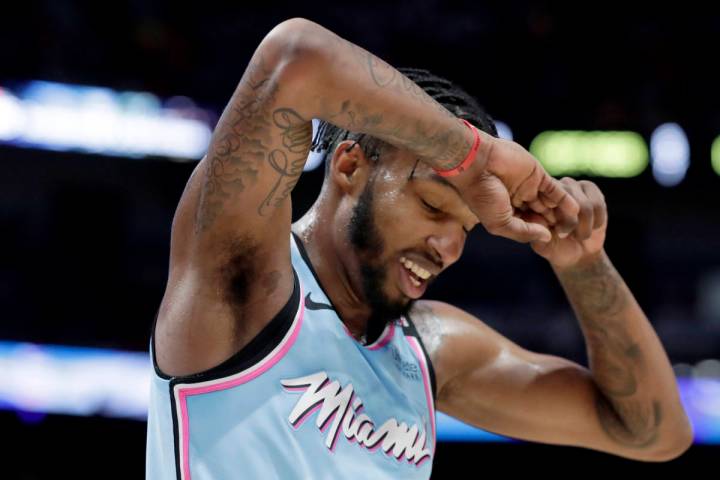 In this Jan. 28, 2020, file photo, Miami Heat forward Derrick Jones Jr. reacts after being call ...