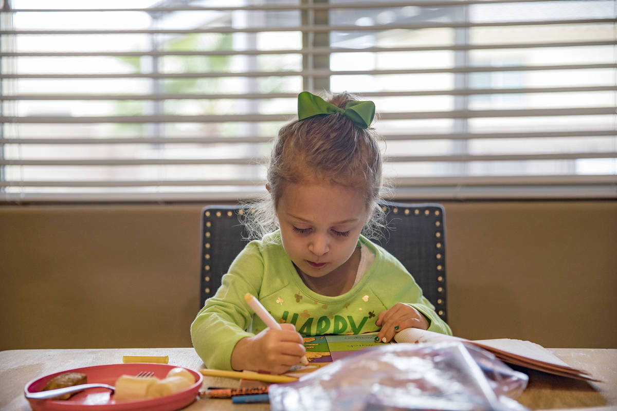 Angie Doleshal, 3, colors at her home in Henderson, Tuesday, March 17, 2020, after Clark County ...