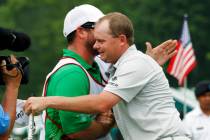Ted Potter Jr. hugs his caddie as he celebrates winning the Greenbrier Classic PGA Golf tournam ...