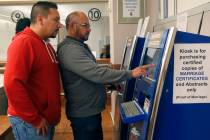 Raul Luna, 37, left, and Luis Zamarripa, 49, right, purchases their marriage certificate at th ...