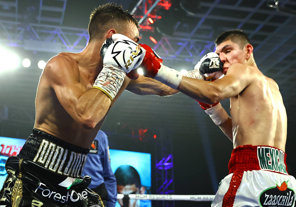 Jason Moloney, left, and Leonardo Baez fight Thursday, June 25, 2020, on a ...