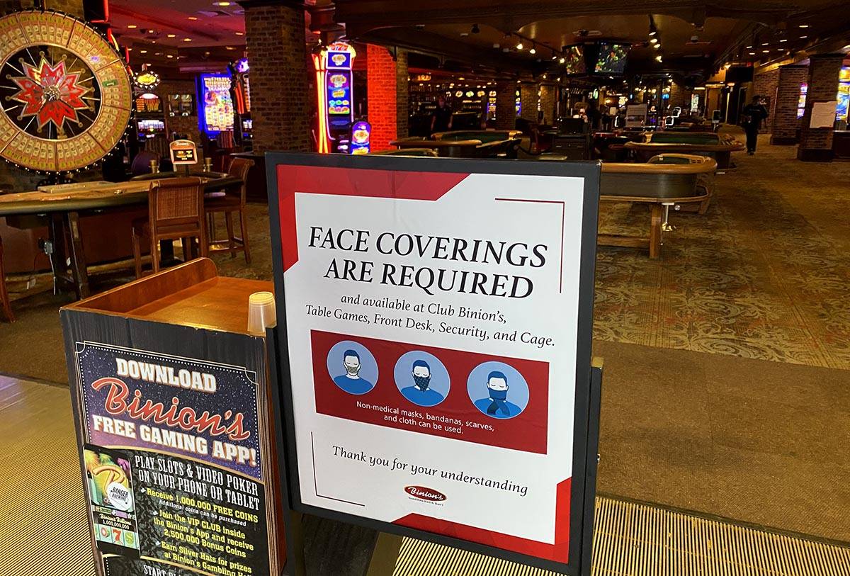 A sign notifying guests of face covering requirement at Binion's in downtown Las Vegas on Frida ...