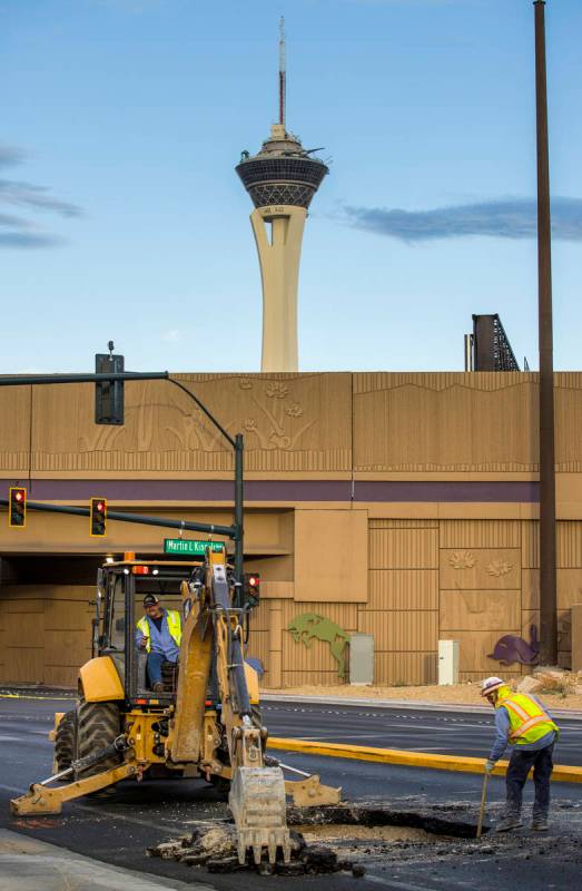 Las Vegas Valley Water District workers begin to repair a sinkhole which opened up and damaged ...