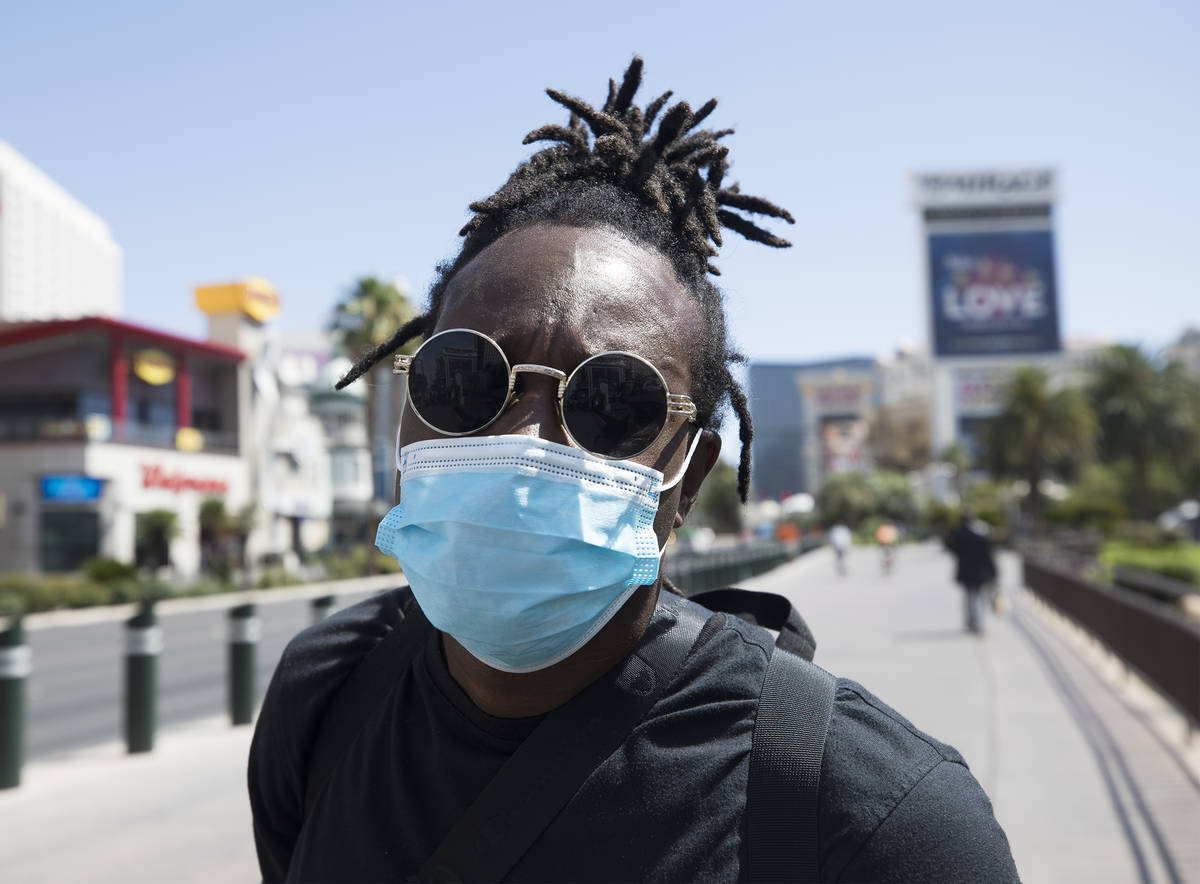 Antonio Skiiboski Wheeler, of Orlando, shows his mask on the Strip in Las Vegas, Sunday, June 2 ...