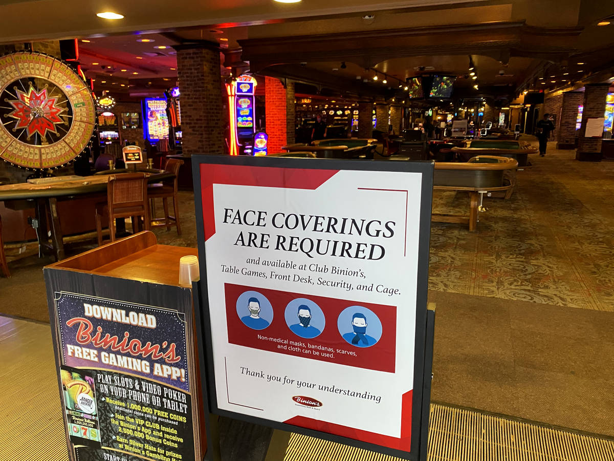 A sign notifying guests of face covering requirement at Binion's in downtown Las Vegas Friday, ...
