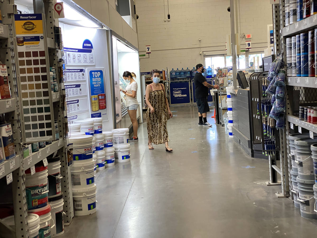 Shoppers don face masks while shopping at Lowe's on East Charleston Boulevard near Fremont Stre ...