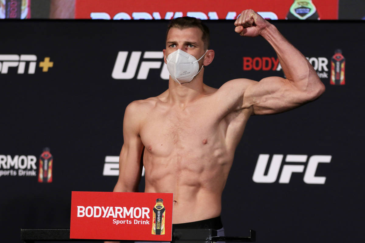 UFC lightweight Dan Hooker poses on the scale at the UFC Apex during weigh-ins for UFC on ESPN ...