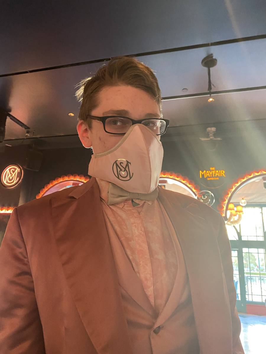 Mayfair Supper Club pianist Patrick Hogan is shown in his club-branded mask on Thursday, June 4 ...