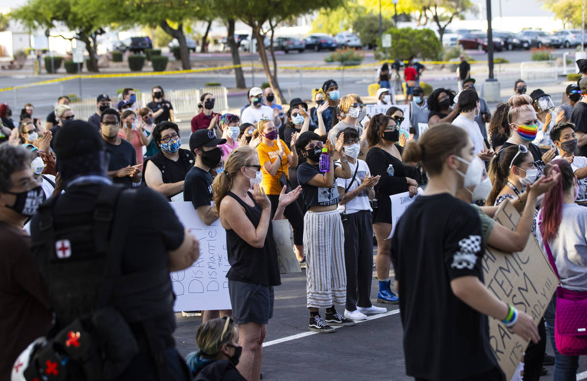 People cheer during a Black Lives Matter rally at the Sawyer Building in Las Vegas on Friday, J ...