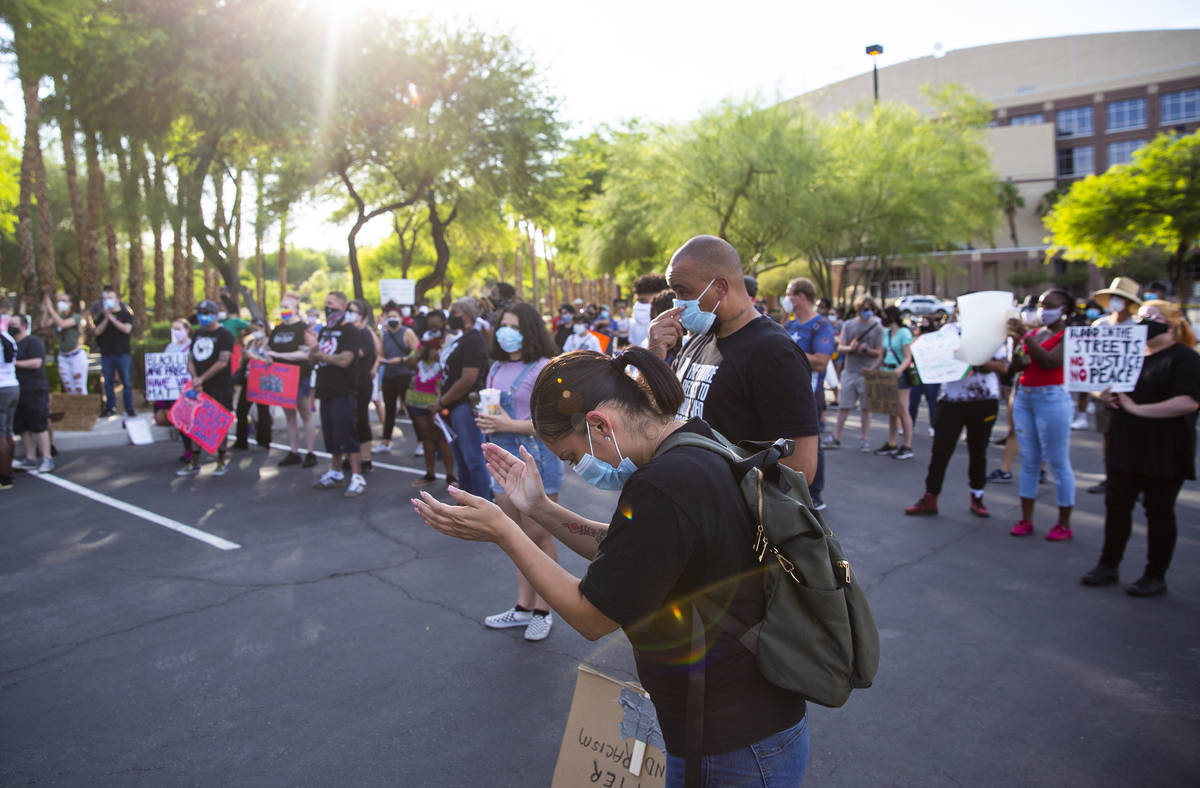 People react as Minister Vance "Stretch" Sanders, not pictured, speaks during a Black Lives Mat ...