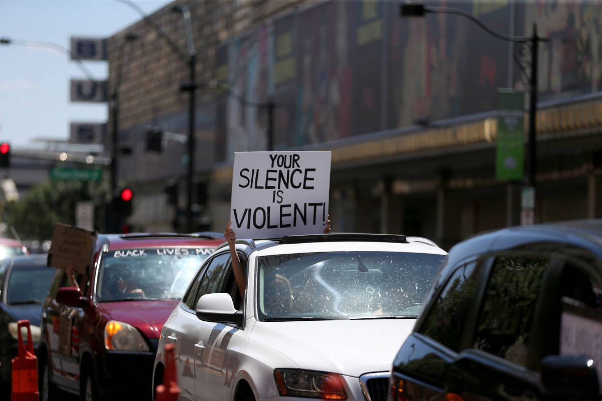 People participate in a Black Lives Matter parade near the intersection of Main Street an Fremo ...