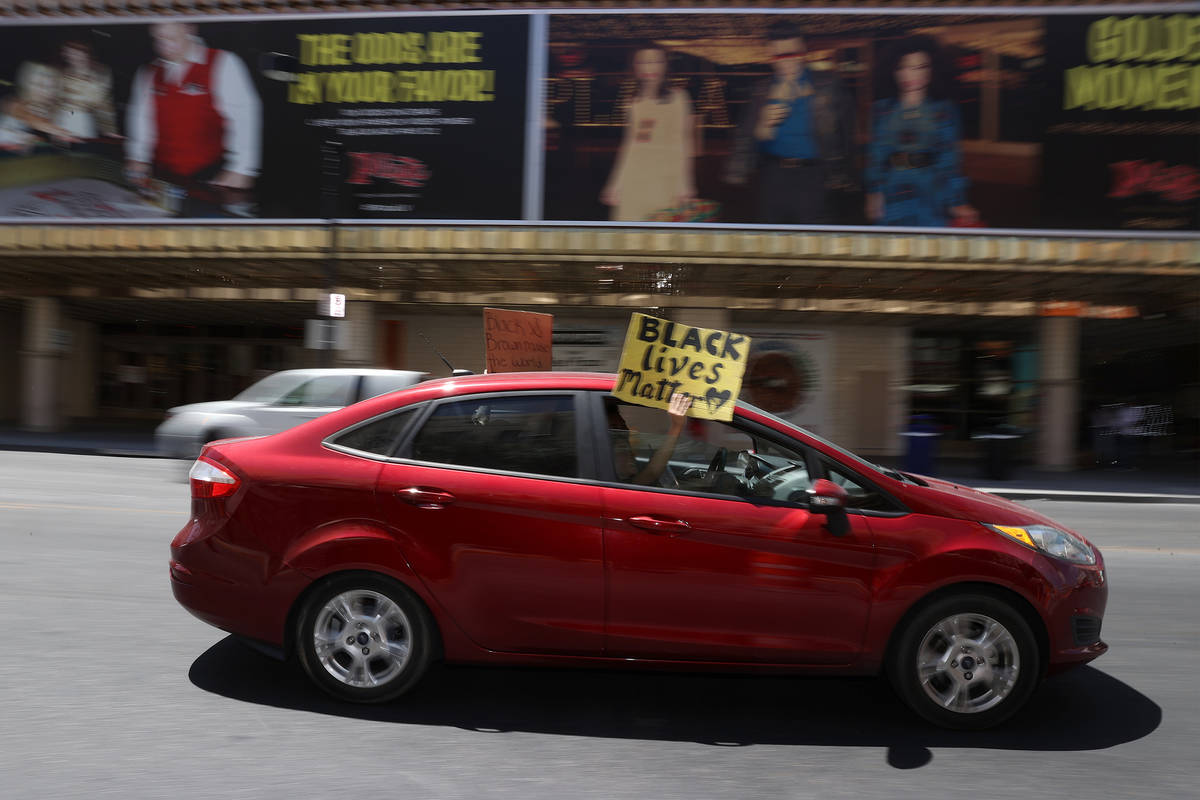 People participate in a Black Lives Matter parade near the intersection of Main Street an Fremo ...