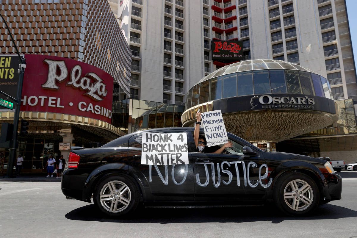 People participate in a Black Lives Matter parade near the intersection of Main Street an Fremo ...