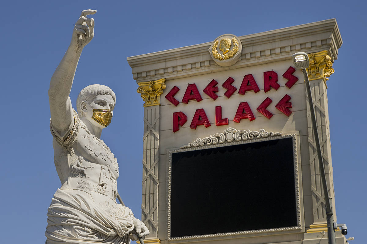 Caesar welcomes all out front while wearing a golden face mask following re-opening ceremonies ...