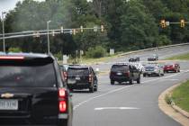 The motorcade for President Donald Trump travels en route to Trump National Golf Club, Sunday, ...