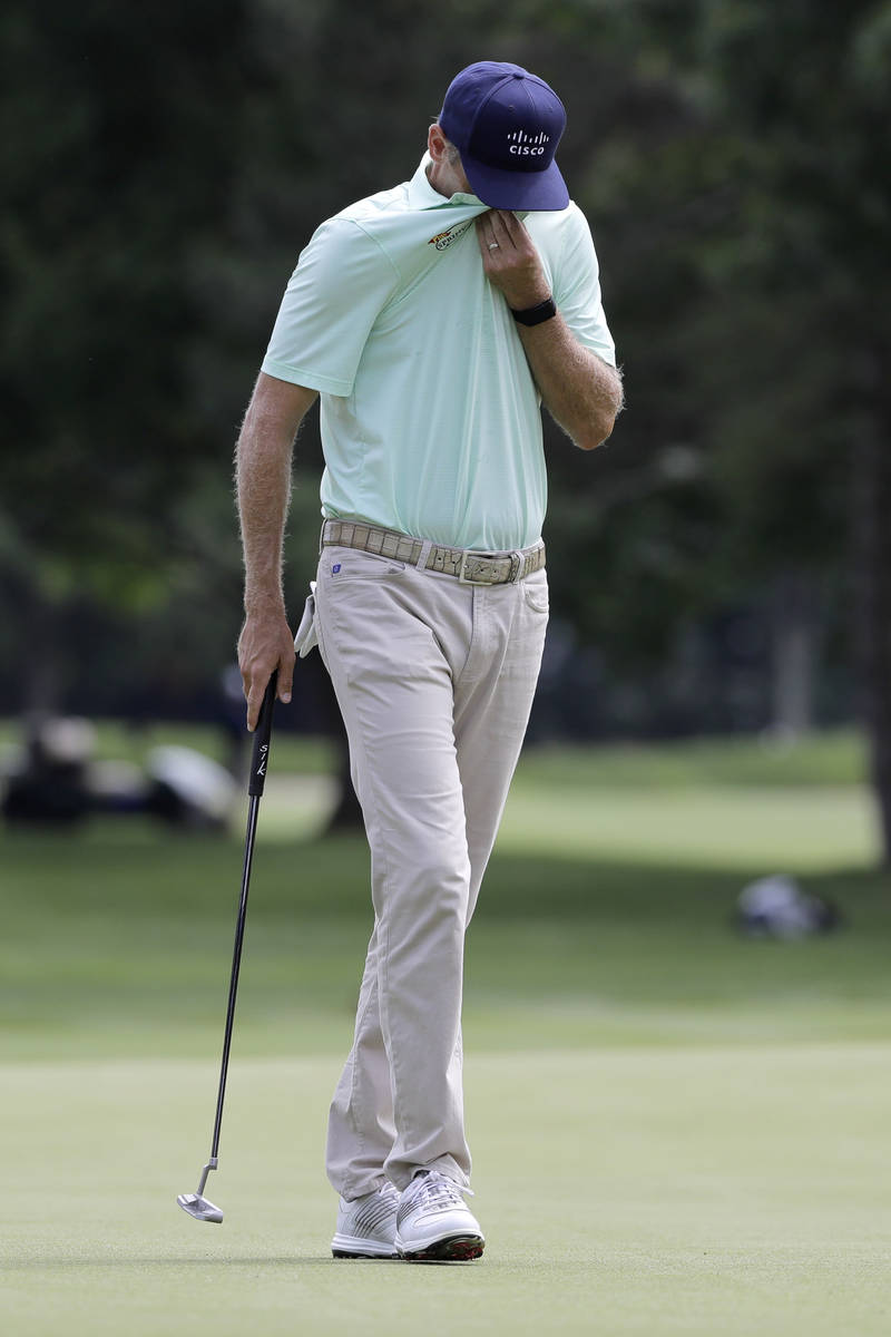 Brendon Todd reacts after putting on the fifth green during the final round of the Travelers Ch ...