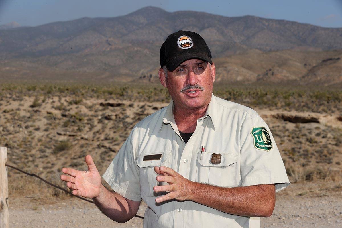 Ray Johnson, a fire prevention officer with the U.S. Forest Service, updates the news media abo ...
