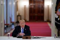 President Donald Trump listens during a meeting with the American Workforce Policy Advisory Boa ...