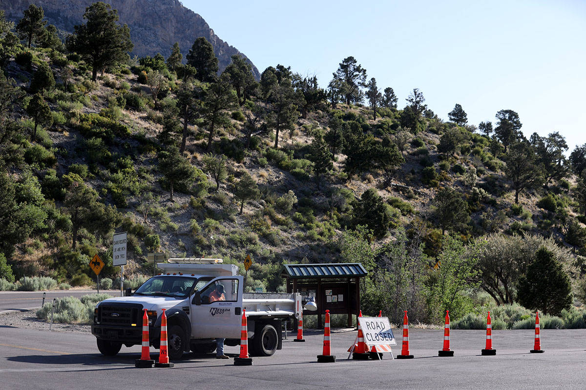 State Route 158, also known as Deer Creek Road, is closed at Kyle Canyon Road as firefighters b ...