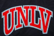 UNLV football quarterback Armani Rogers, head coach Tony Sanchez and linebacker Javin White par ...