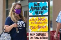 Customers line up to enter Trader Joe's on Friday, June 26, 2020, in Henderson. (Bizuayehu Tes ...