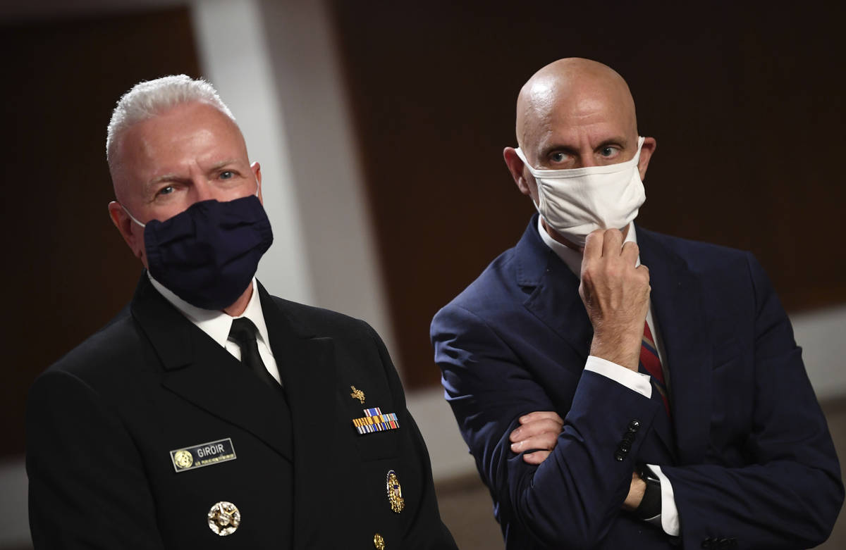 Adm. Brett Giroir, left, director of the U.S. coronavirus diagnostic testing, and Food and Drug ...