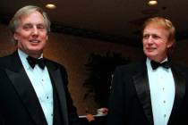 FILE - In this Nov. 3, 1999 file photo, Robert Trump, left, joins real estate developer and pre ...