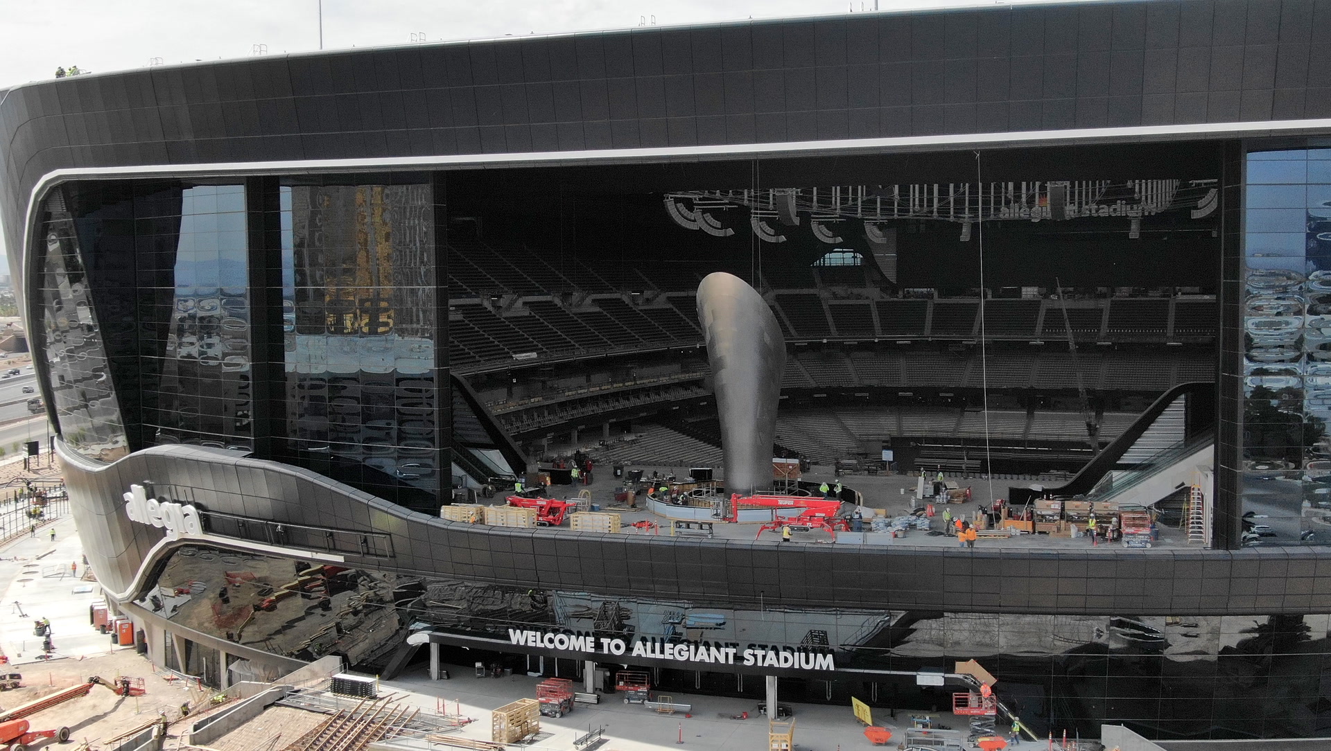 Allegiant Stadium lanai doors open to reveal Al Davis torch Allegiant