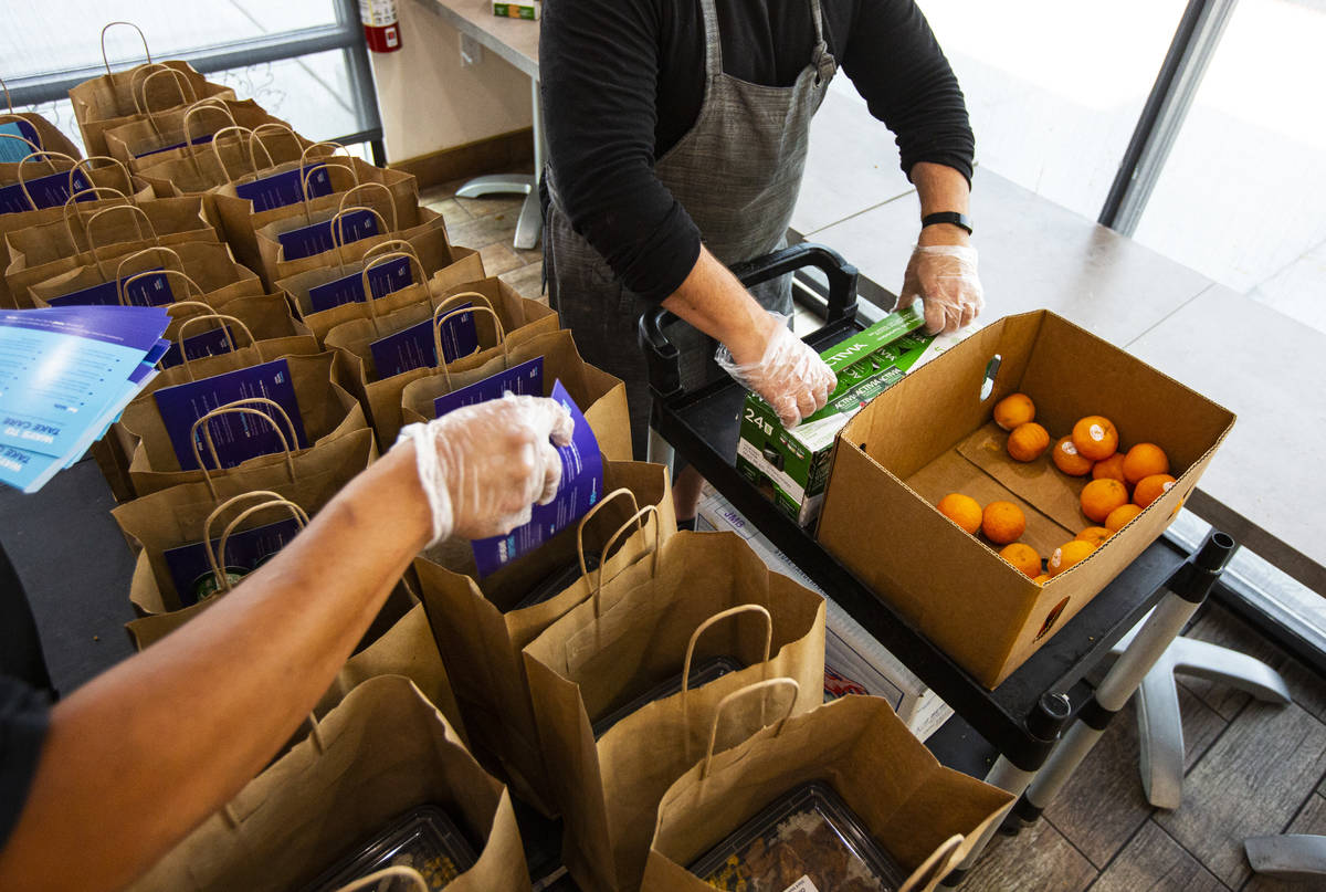 Paras Shah, left, and Jeffrey Weiss, co-owners and co-chefs at Valencian Gold, package meals fo ...