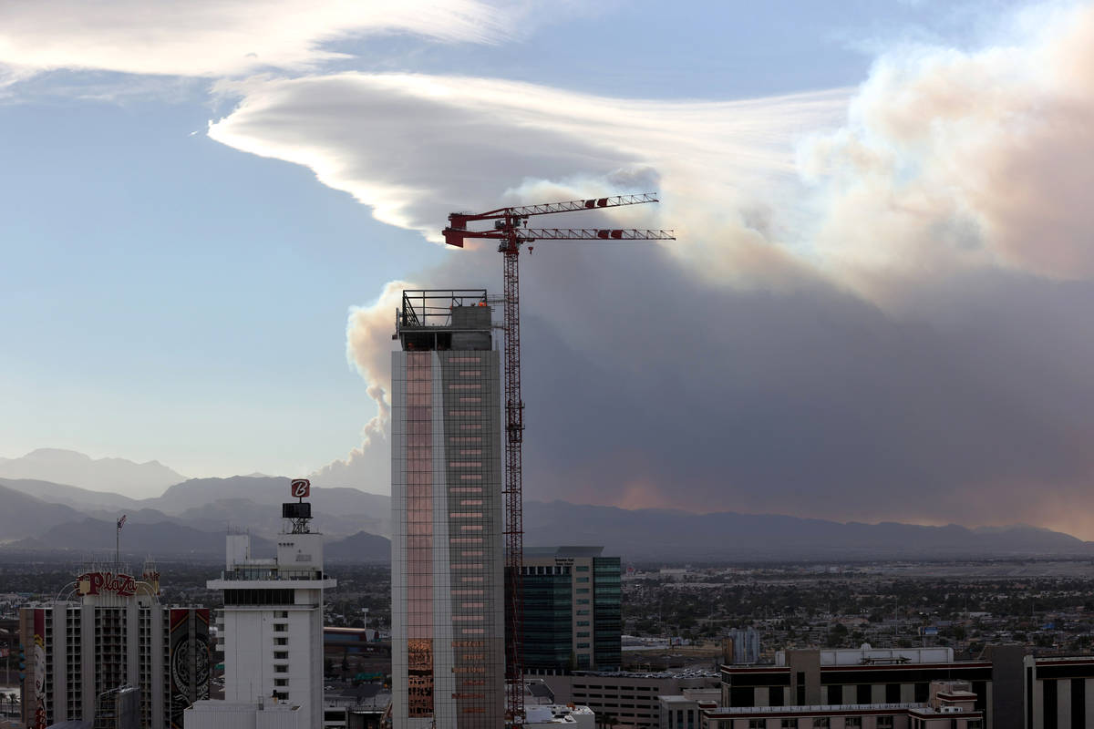 Smoke from a wildfire at Mount Charleston is seen from downtown Las Vegas Sunday, June 28, 2020 ...