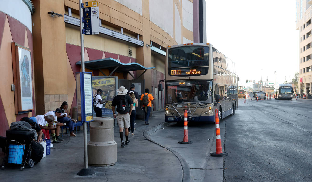 People line up to board a Regional Transportation Commission bus on Las Vegas Boulevard at Frem ...