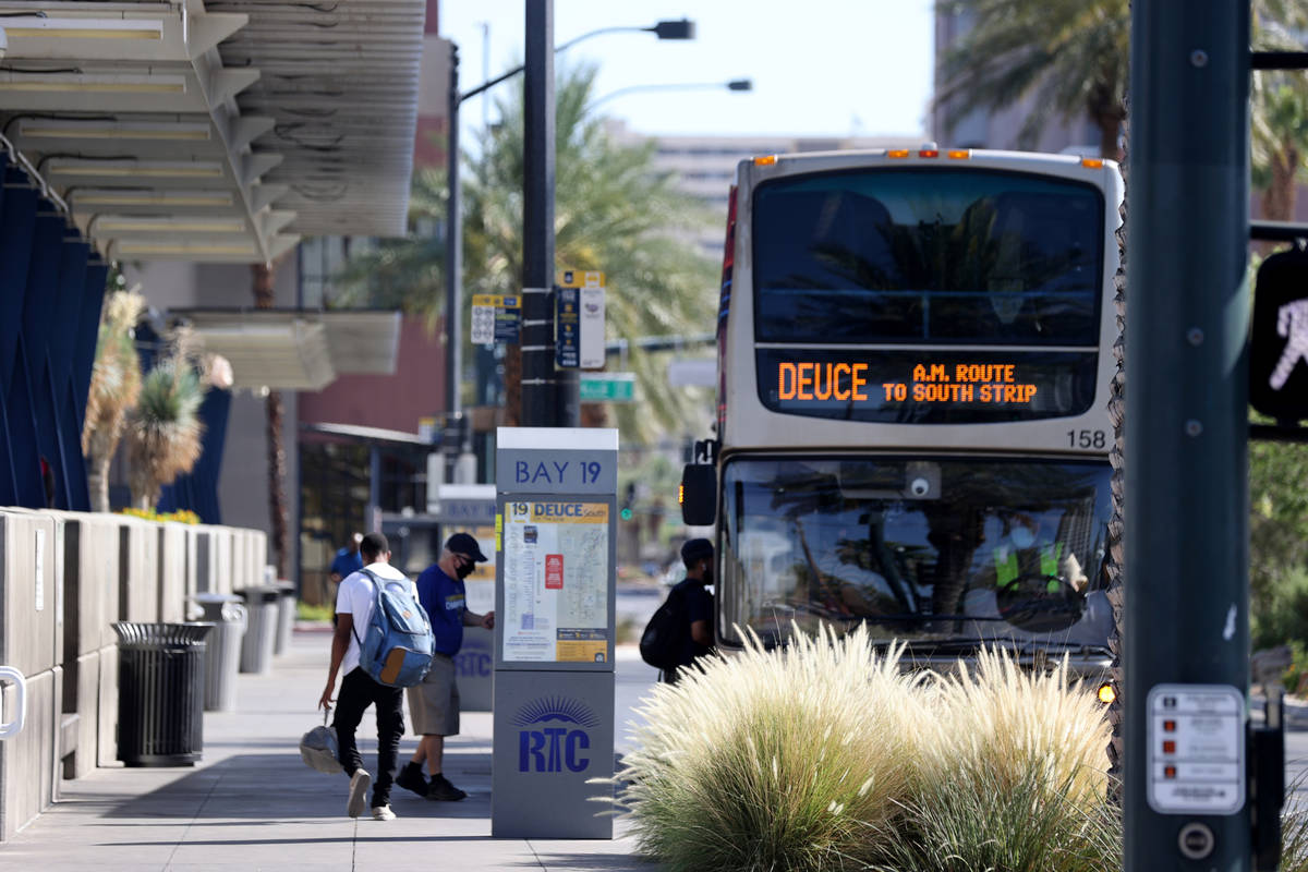 People board a Regional Transportation Commission bus at a stop on Casino Center Boulevard at G ...