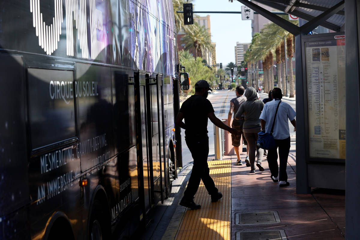 People get off a Regional Transportation Commission bus at a stop on Casino Center Boulevard at ...