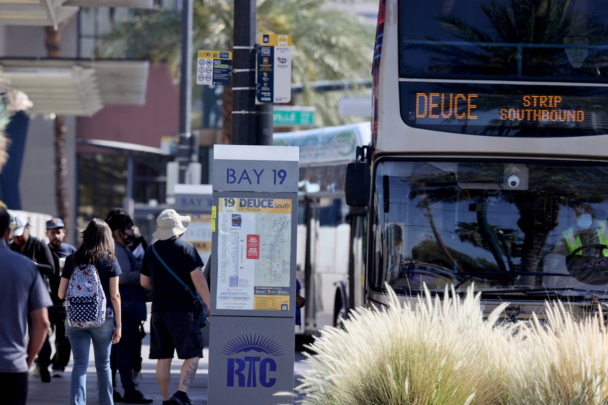 People board a Regional Transportation Commission bus at a stop on Casino Center Boulevard at G ...