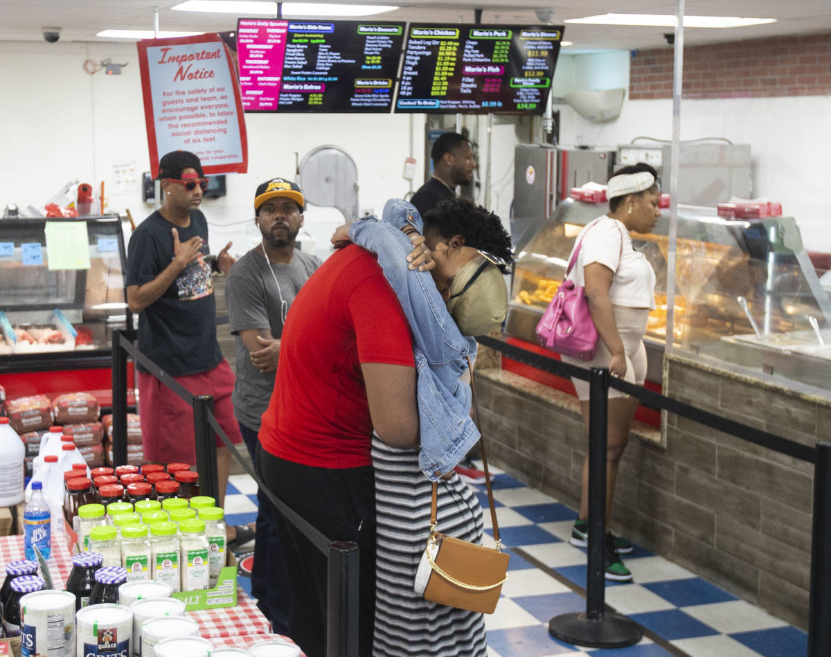 Customers wait in line to order at Mario's Westside Market on Wednesday, June 17, 2020, in Las ...