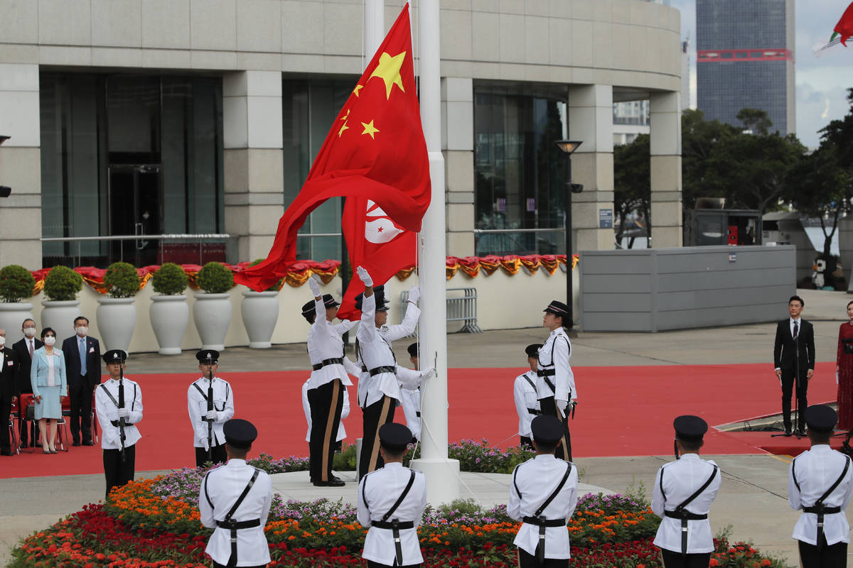 A flag raising ceremony is held at the Golden Bauhinia Square to mark the anniversary of the Ho ...