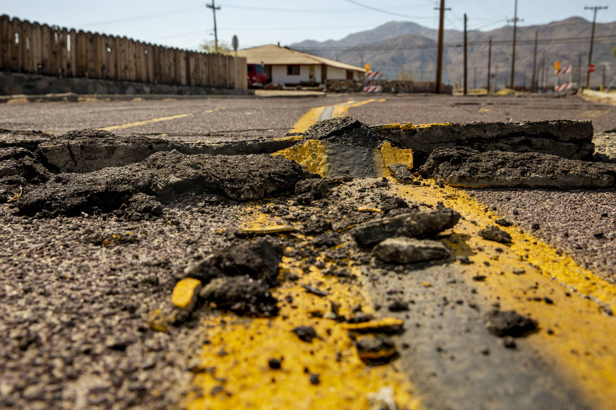 Extensive cracks with shifting pavement have opened up and forced road closures in Trona, Calif ...