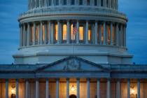 FILE - In this May 3, 2020, file photo, light shines from inside the U.S. Capitol dome at dusk ...