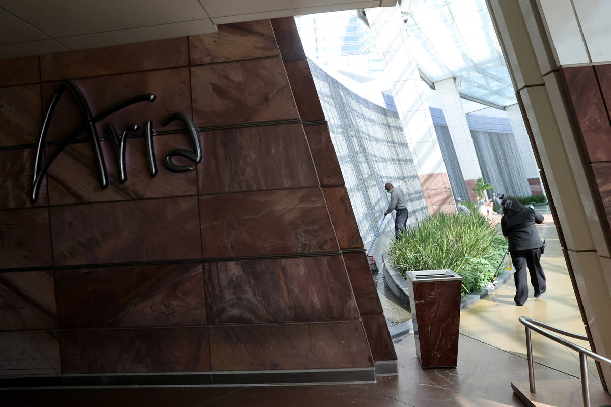 Workers put the finishing touches on Aria on the Strip in Las Vegas before reopening Wednesday, ...