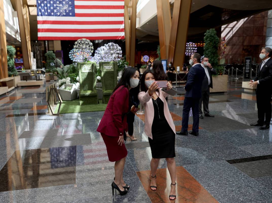Director of Customer Development Muoi Lam, left, and Marketing Executive Linda Hong take a phot ...