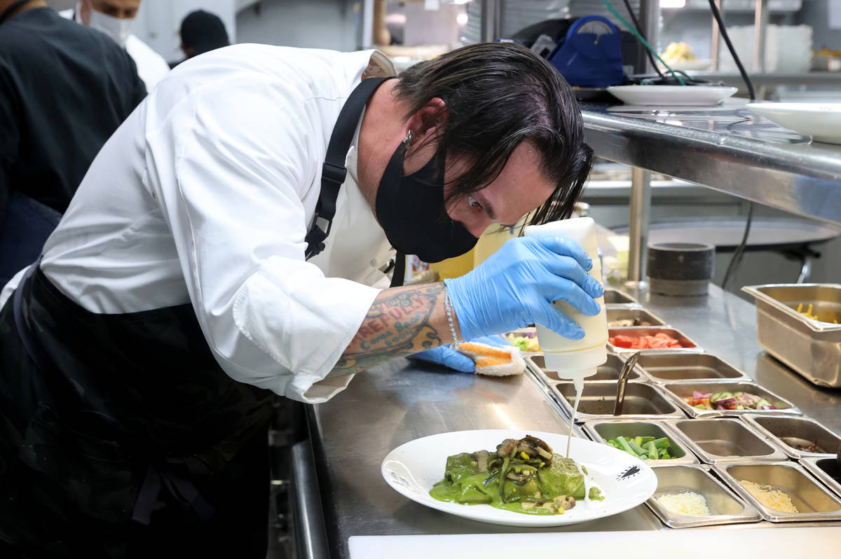 Border Grill Executive Chef Mike Minor makes Chicken Poblano Enchiladas at Mandalay Bay on the ...