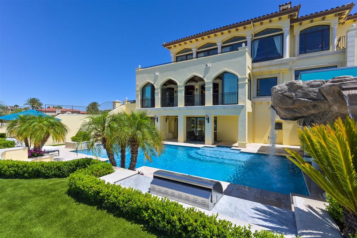 The three-story home features a large pool. (Luxurious Real Estate)